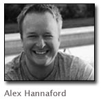 Black and white photo of Alex Hannaford smiling.
