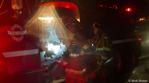 Two of many firefighters from several jurisdictions at a house fire in Lake Stevens on Sunday evening.