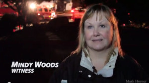 Mindy Woods says she first heard 3 explosions, then looked out her window and saw the fire across the street. Woods says she called 911 right away.