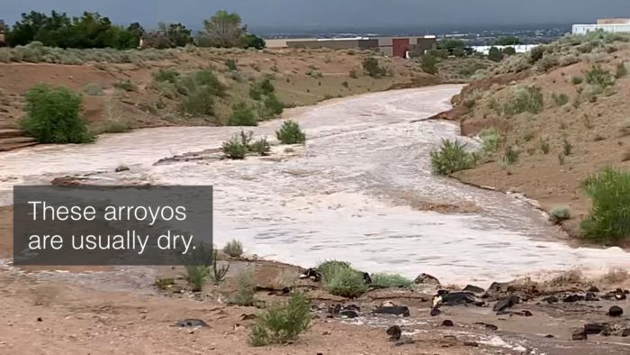Water rushing in a desert arroyo. Text over image states, "These arroyos are usually dry."